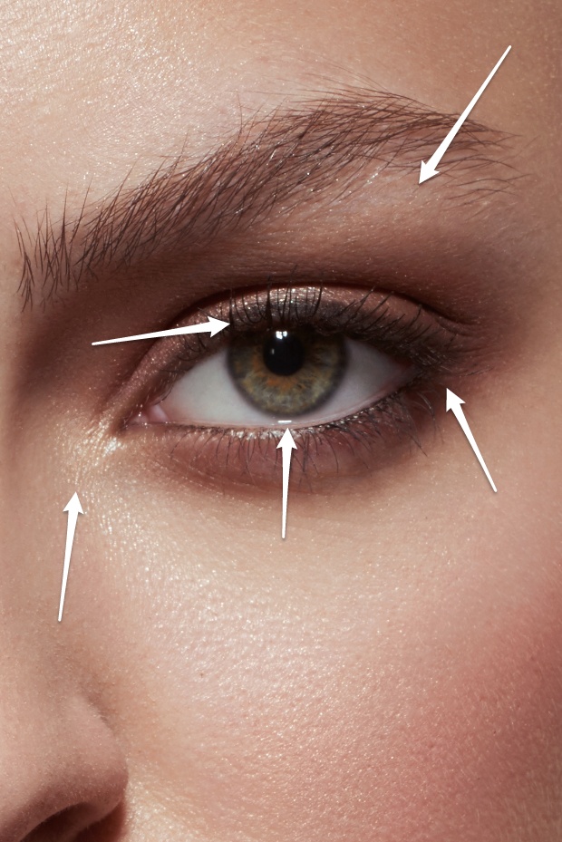 Highlighter in the corner of the eye and under the eyebrow, defined upper lashline, nude lower waterline and darkened outer corner.